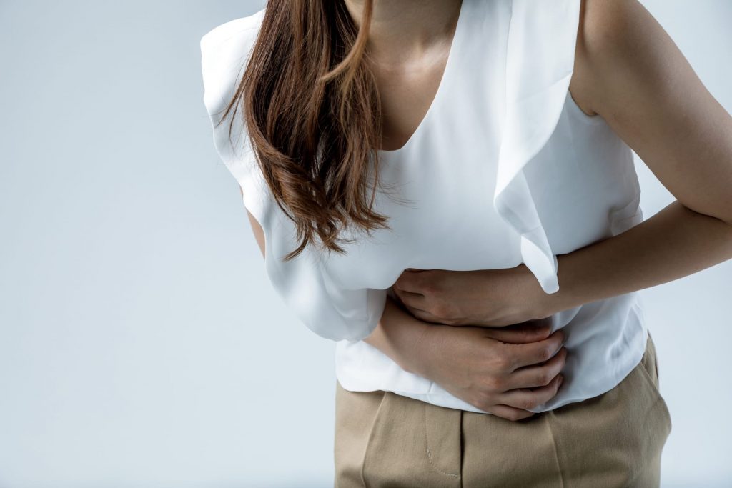 Woman in digestive discomfort