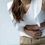 Woman in digestive discomfort