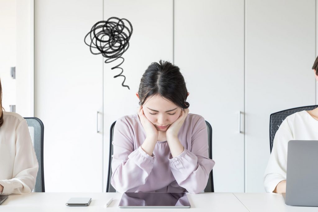 A woman wondering if her stomach problems are being caused by her gut issues.